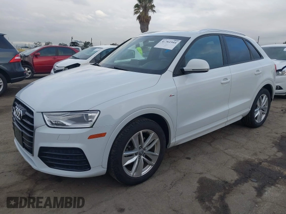 2018 Audi Q3 Premium z VIN WA1BCCFSXJR028356, wystawiony jako IAAI lot #41761544 z przebiegiem 82 877 mil mil oraz . Historia ofert i sprzedaży dostępna na DreamBid. Obrazek 18.