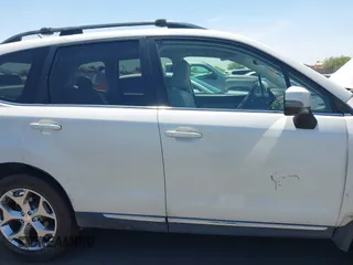2015 Subaru Forester Touring with VIN JF2SJAWC8FH588321, listed as a IAAI auction lot 42689364 with 103,642 mi miles and . Bid and sale history available at DreamBid. Image 13.