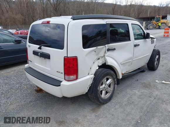 2007 Dodge Nitro SXT with VIN 1D8GU28K77W727391, listed as a IAAI auction lot 41869288 with 214,920 mi miles. Bid and sale history available at carsss.com. Image 4.