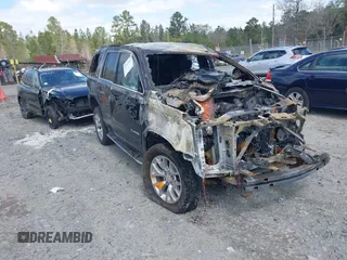 2017 GMC Yukon SLE with VIN 1GKS2AKC6HR351197, listed as a IAAI auction lot 41823017 with 106,936 mi miles. Bid and sale history available at carsss.com. Image 1.