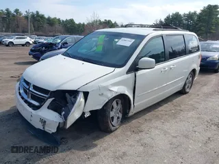 2012 Dodge Grand Caravan SXT with VIN 2C4RDGCGXCR358794, listed as a IAAI auction lot 42007316 with 212,518 mi miles and . Bid and sale history available at DreamBid. Image 2.