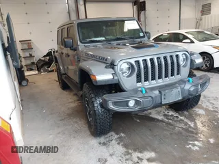 2021 Jeep Wrangler Unlimited Rubicon z VIN 1C4JJXR65MW675010, wystawiony jako IAAI lot #41990021 z przebiegiem 73 406 mil mil oraz . Historia ofert i sprzedaży dostępna na DreamBid. Obrazek 1.