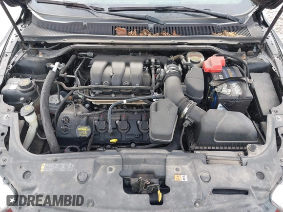 2013 Ford Taurus SEL with VIN 1FAHP2E86DG135835, listed as a IAAI auction lot 41665430 with 130,816 mi miles. Bid and sale history available at carsss.com. Image 10.