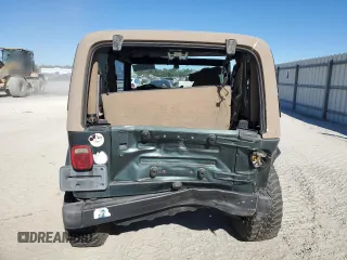 2002 Jeep Wrangler Sahara with VIN 1J4FA59S02P761365, listed as a Copart auction lot 81899144 with 208,429 mi miles and Salvage title. Bid and sale history available at DreamBid. Image 6.