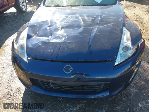 2014 Nissan 370Z Nismo with VIN JN1AZ4EH9EM635608, listed as a IAAI auction lot 41333034 with 45,354 mi miles and . Bid and sale history available at DreamBid. Image 6.