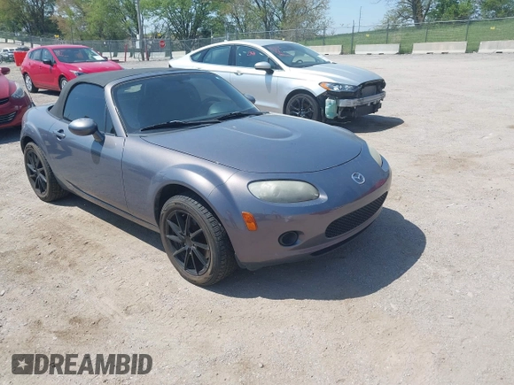 2007 Mazda MX-5 Miata Sport z VIN JM1NC25F570130226, wystawiony jako IAAI lot #42227544 z przebiegiem 150 035 mil mil oraz . Historia ofert i sprzedaży dostępna na DreamBid. Obrazek 1.