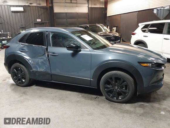 2022 Mazda CX-30 S Carbon Edition with VIN 3MVDMBCL8NM447234, listed as a IAAI auction lot 42511600 with 51,926 mi miles and . Bid and sale history available at DreamBid. Image 13.