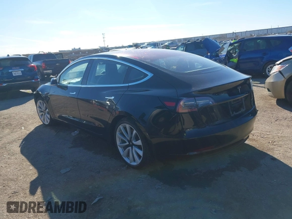 2018 Tesla Model 3 Long Range Battery with VIN 5YJ3E1EA2JF014975, listed as a IAAI auction lot 41319407 with 106,301 mi miles and . Bid and sale history available at DreamBid. Image 3.