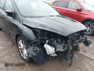 2016 Ford Focus SE z VIN 1FADP3F25GL386582, wystawiony jako IAAI lot #41097395 z przebiegiem 101 479 mil mil oraz . Historia ofert i sprzedaży dostępna na DreamBid. Obrazek 6.