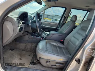 2004 Ford Explorer XLT z VIN 1FMZU63K84ZA25995, wystawiony jako Copart lot #64020595 z przebiegiem 239 155 mil mil oraz Szkoda całkowita • Salvage title. Historia ofert i sprzedaży dostępna na DreamBid. Obrazek 7.