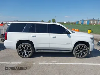2015 Chevrolet Tahoe LT with VIN 1GNSCBKCXFR552071, listed as a IAAI auction lot 41972157 with 214,738 mi miles and . Bid and sale history available at DreamBid. Image 13.