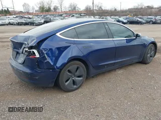 2018 Tesla Model 3 Long Range Battery with VIN 5YJ3E1EB2JF056166, listed as a IAAI auction lot 41847972 with 126,126 mi miles and . Bid and sale history available at DreamBid. Image 4.