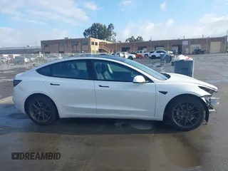 2021 Tesla Model 3 Long Range with VIN 5YJ3E1EB9MF055990, listed as a IAAI auction lot 41584065 with 49,147 mi miles and . Bid and sale history available at carsss.com. Image 14.