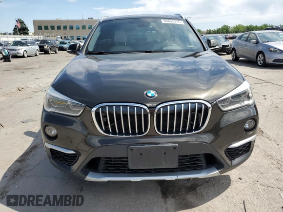 2017 BMW X1 xDrive28i with VIN WBXHT3C32H5F71690, listed as a Copart auction lot 60852375 with 67,475 mi miles and Salvage title. Bid and sale history available at DreamBid. Image 5.