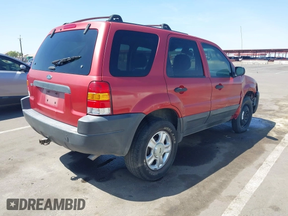 2003 Ford Escape XLT Popular 2 with VIN 1FMYU93123KB02310, listed as a IAAI auction lot 41975073 with 169,864 mi miles. Bid and sale history available at carsss.com. Image 4.