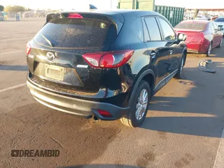 2016 Mazda CX-5 Touring with VIN JM3KE2CY5G0704574, listed as a IAAI auction lot 41033546 with 133,502 mi miles. Bid and sale history available at carsss.com. Image 4.