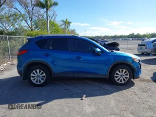 2014 Mazda CX-5 Touring with VIN JM3KE2CYXE0310873, listed as a IAAI auction lot 41309633 with 175,325 mi miles and . Bid and sale history available at DreamBid. Image 14.