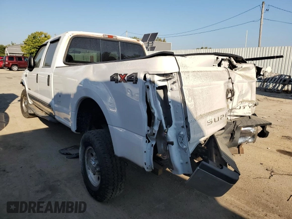 2000 Ford F-350 XL with VIN 1FTSW31F7YED79895, listed as a Copart auction lot 71744804 with 176,241 mi miles and Salvage Title. Bid and sale history available at DreamBid. Image 2.