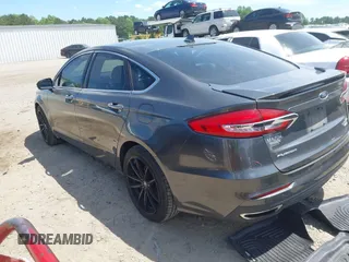 2019 Ford Fusion Titanium with VIN 3FA6P0D9XKR152617, listed as a IAAI auction lot 42209470 with 135,956 mi miles and . Bid and sale history available at DreamBid. Image 3.