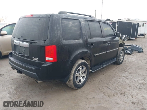 2011 Honda Pilot Touring with VIN 5FNYF4H94BB089930, listed as a IAAI auction lot 41477596 with 171,831 mi miles. Bid and sale history available at carsss.com. Image 4.