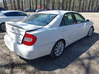 2003 Toyota Camry LE z VIN JTDBF30K930147772, wystawiony jako IAAI lot #41768713 z przebiegiem 231 537 mil mil oraz . Historia ofert i sprzedaży dostępna na DreamBid. Obrazek 4.