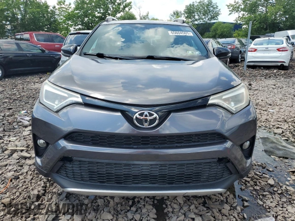 2016 Toyota RAV4 SE with VIN 2T3JFREV9GW478029, listed as a Copart auction lot 65604565 with 61,861 mi miles and Salvage title. Bid and sale history available at DreamBid. Image 5.