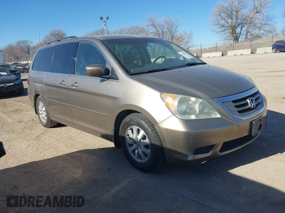 2010 Honda Odyssey EX-L with VIN 5FNRL3H79AB048049, listed as a IAAI auction lot 41440910 with 142,385 mi miles. Bid and sale history available at carsss.com. Image 1.