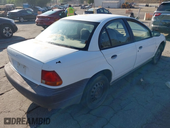 1998 Saturn SL z VIN 1G8ZG5283WZ233209, wystawiony jako IAAI lot #40997373 z przebiegiem 240 385 mil mil oraz . Historia ofert i sprzedaży dostępna na DreamBid. Obrazek 4.