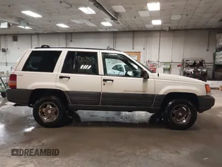 1997 Jeep Grand Cherokee Laredo z VIN 1J4GZ58S9VC562907, wystawiony jako IAAI lot #42102313 z przebiegiem 137 672 mil mil oraz . Historia ofert i sprzedaży dostępna na DreamBid. Obrazek 13.
