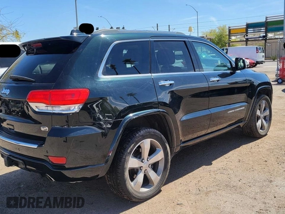 2014 Jeep Grand Cherokee Overland with VIN 1C4RJFCT7EC187319, listed as a Copart auction lot 55284615 with 98,314 mi miles and Clean Title. Bid and sale history available at DreamBid. Image 4.