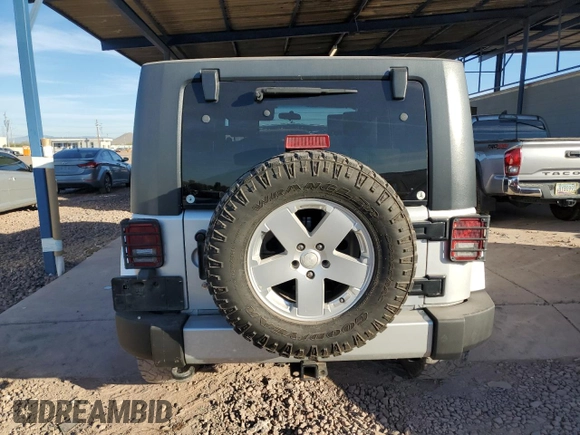 2010 Jeep Wrangler Unlimited Sahara with VIN 1J4HA5H13AL184449, listed as a Copart auction lot 43421945 with 176,725 mi miles and Salvage Title. Bid and sale history available at carsss.com. Image 6.