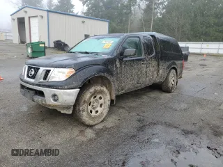 2009 Nissan Frontier SE with VIN 1N6BD06T19C411446, listed as a Copart auction lot 87683185 with 132,992 mi miles and Salvage title. Bid and sale history available at DreamBid. Image 1.
