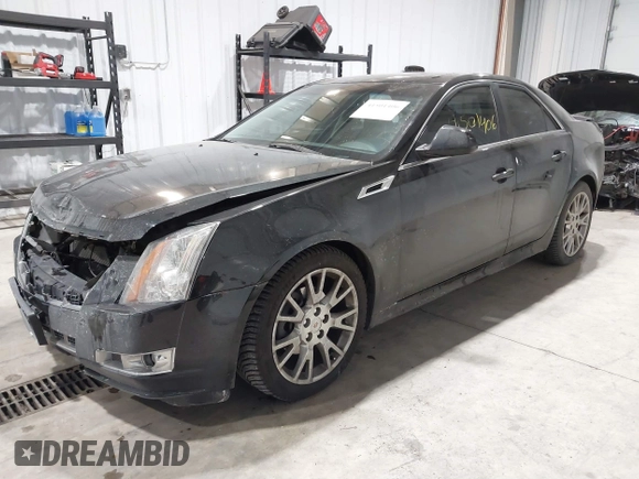 2013 Cadillac CTS Premium z VIN 1G6DS5E34D0103328, wystawiony jako IAAI lot #41501406 z przebiegiem 157 633 mil mil oraz . Historia ofert i sprzedaży dostępna na DreamBid. Obrazek 2.