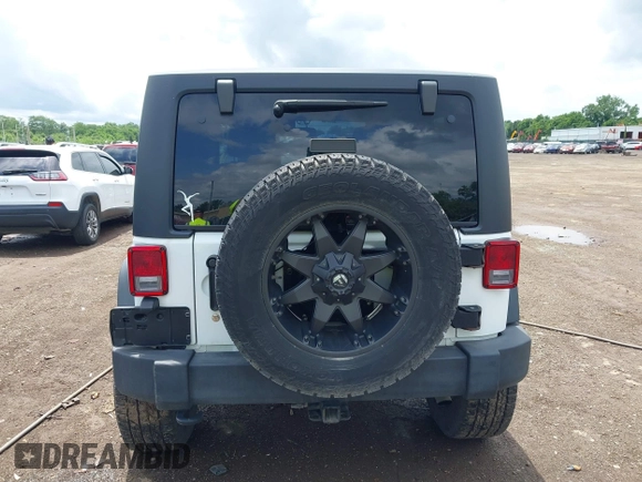 2016 Jeep Wrangler Black Bear with VIN 1C4AJWAG7GL106809, listed as a IAAI auction lot 42513015 with 86,730 mi miles and . Bid and sale history available at DreamBid. Image 16.