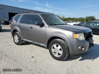 2010 Ford Escape XLT with VIN 1FMCU0DG6AKD05058, listed as a Copart auction lot 50449035 with 127,781 mi miles and Salvage Title. Bid and sale history available at carsss.com. Image 4.