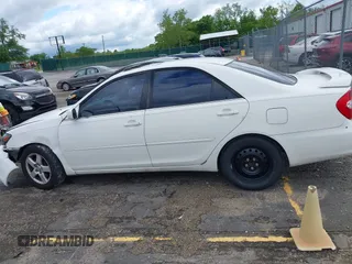 2002 Toyota Camry XLE z VIN 4T1BF30K72U500934, wystawiony jako IAAI lot #42312967 z przebiegiem 169 569 mil mil oraz . Historia ofert i sprzedaży dostępna na DreamBid. Obrazek 14.