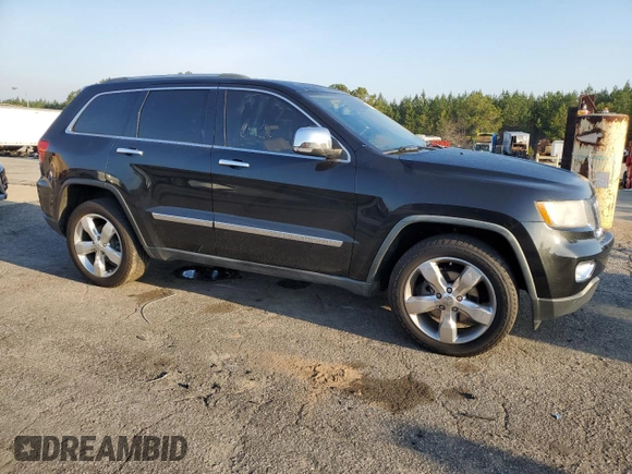 2011 Jeep Grand Cherokee Overland with VIN 1J4RS6GT5BC648076, listed as a Copart auction lot 48878135 with 223,263 mi miles and Salvage Title. Bid and sale history available at DreamBid. Image 4.