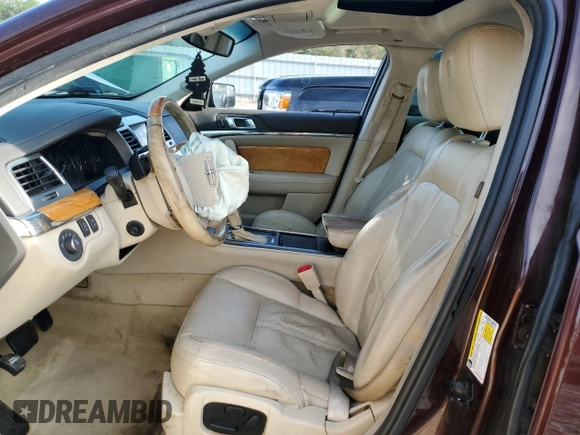 2012 Lincoln MKS with VIN 1LNHL9ERXCG801273, listed as a Copart auction lot 82476574 with 203,370 mi miles and Salvage Title. Bid and sale history available at DreamBid. Image 7.