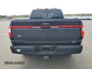 2022 Ford F-150 Lightning Pro z VIN 1FT6W1EV7NWG10601, wystawiony jako Copart lot #55057445 z przebiegiem Nie podano mil oraz Szkoda całkowita • Salvage title. Historia ofert i sprzedaży dostępna na DreamBid. Obrazek 6.