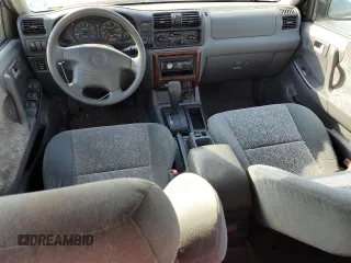 2002 Isuzu Rodeo S z VIN 4S2CK58W424342189, wystawiony jako Copart lot #76187294 z przebiegiem 139 827 mil mil oraz Szkody całkowita. Historia ofert i sprzedaży dostępna na DreamBid. Obrazek 8.