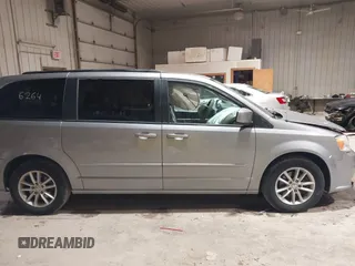 2014 Dodge Grand Caravan SXT z VIN 2C4RDGCGXER263963, wystawiony jako IAAI lot #41956264 z przebiegiem 138 815 mil mil oraz . Historia ofert i sprzedaży dostępna na DreamBid. Obrazek 13.