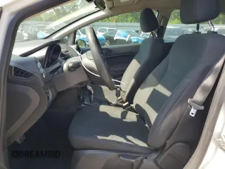 2019 Ford Fiesta SE z VIN 3FADP4BJ2KM147288, wystawiony jako Copart lot #55391125 z przebiegiem 83 887 mil mil oraz Szkoda całkowita • Salvage title. Historia ofert i sprzedaży dostępna na DreamBid. Obrazek 7.