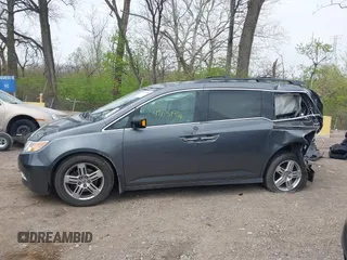 2012 Honda Odyssey Touring with VIN 5FNRL5H99CB028304, listed as a IAAI auction lot 42031916 with 216,185 mi miles and . Bid and sale history available at DreamBid. Image 15.