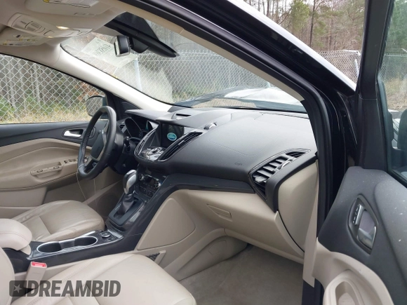 2016 Ford Escape Titanium with VIN 1FMCU9J91GUA59639, listed as a IAAI auction lot 41058369 with 138,046 mi miles. Bid and sale history available at carsss.com. Image 5.