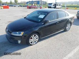 2013 Volkswagen Jetta GLI with VIN 3VW4S7AJ2DM300120, listed as a IAAI auction lot 42002950 with 106,304 mi miles and . Bid and sale history available at DreamBid. Image 2.
