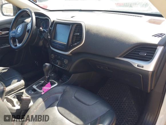 2014 Jeep Cherokee Trailhawk with VIN 1C4PJMBS8EW163212, listed as a IAAI auction lot 42124107 with 114,999 mi miles. Bid and sale history available at carsss.com. Image 5.