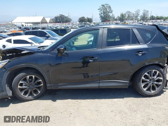 2016 Mazda CX-5 Grand Touring z VIN JM3KE2DY6G0900005, wystawiony jako IAAI lot #42311162 z przebiegiem 80 758 mil mil oraz . Historia ofert i sprzedaży dostępna na DreamBid. Obrazek 15.