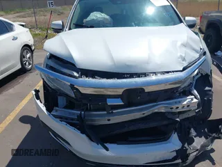 2021 Honda Pilot Touring 8-Passenger z VIN 5FNYF6H94MB087593, wystawiony jako IAAI lot #42153310 z przebiegiem 30 400 mil mil oraz . Historia ofert i sprzedaży dostępna na DreamBid. Obrazek 12.
