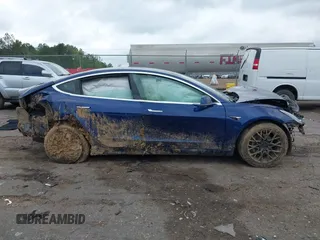 2019 Tesla Model 3 Mid Range z VIN 5YJ3E1EAXKF332974, wystawiony jako IAAI lot #41921722 z przebiegiem Nie podano mil oraz . Historia ofert i sprzedaży dostępna na DreamBid. Obrazek 13.