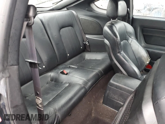 2003 Hyundai Tiburon GT z VIN KMHHN65F13U068658, wystawiony jako Copart lot #81799404 z przebiegiem 163 148 mil mil oraz Szkoda całkowita • Salvage title. Historia ofert i sprzedaży dostępna na DreamBid. Obrazek 10.